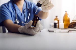Medicine doctor hand working on a patients x-ray scans digital healthcare and connection with modern virtual screen interface icons, Medical technology and network concept. photo