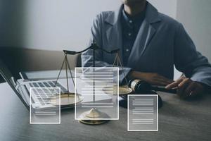 Male lawyer working with contract papers and wooden gavel on tabel in courtroom. justice and law ,attorney, court judge, concept. photo