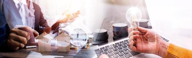 Business team finance or bookkeeper working with a calculator to calculate business data summary report, accountancy document and laptop computer at the office, business meeting concept photo