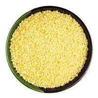 moroccan couscous groats in round bowl isolated photo