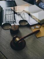 Male lawyer working with contract papers and wooden gavel on tabel in courtroom. justice and law ,attorney, court judge, concept. photo