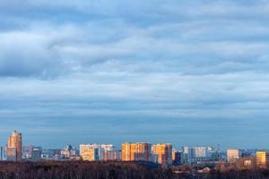 blue clouds over residential district in evening photo