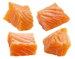 Salmon slices isolated on white background with clipping path, cubes of red fish photo