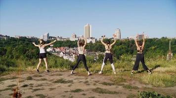 Women group workout outdoors video