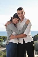 couple relaxing on balcony photo