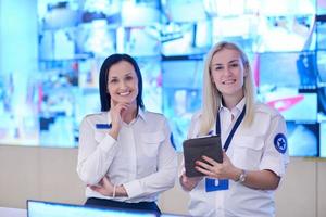 group portrait of Female operator in a security data system control room photo