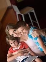 Young Family Using A Tablet To Make Future Plans photo