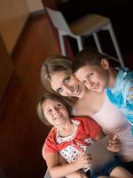 Young Family Using A Tablet To Make Future Plans photo