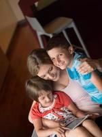 Young Family Using A Tablet To Make Future Plans photo