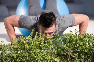 man doing morning yoga exercises photo