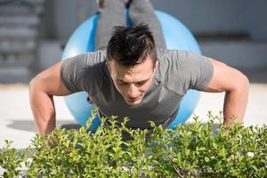 man doing morning yoga exercises photo