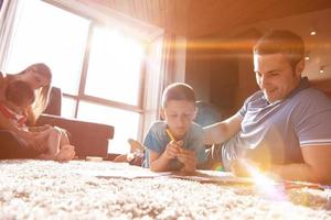 young couple spending time with kids photo