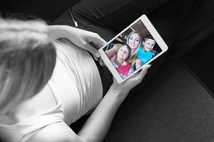 woman using tablet in beautiful apartment photo