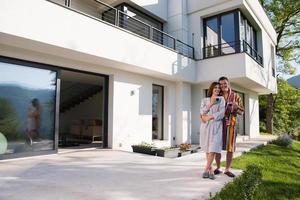 Young beautiful couple in bathrobes photo