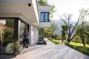 woman in front of her luxury home villa photo