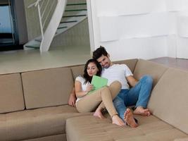 young couple making selfie together at home photo