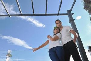 couple relaxing on balcony photo