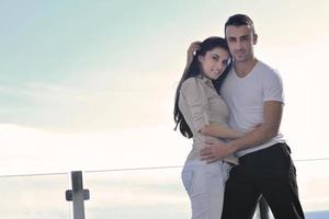 couple relaxing on balcony photo