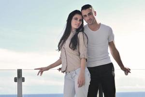 couple relaxing on balcony photo