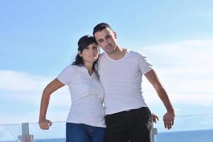 couple relaxing on balcony photo