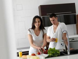 happy young couple in kicthen photo