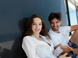 young couple making selfie together at home photo