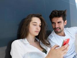 young couple making selfie together at home photo