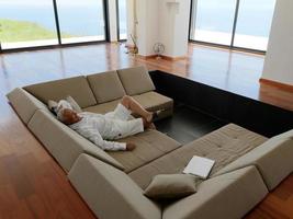 Portrait of senior man relaxing in sofa photo