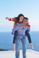 happy young romantic couple have fun relax photo