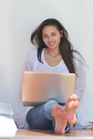 relaxed young woman at home photo