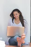 relaxed young woman at home photo