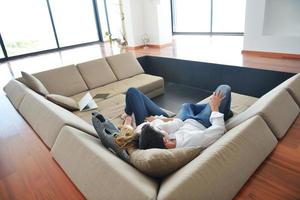 couple at home using tablet computer photo