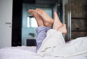 couple relax and have fun in bed photo