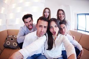 group of friends taking selfie photo