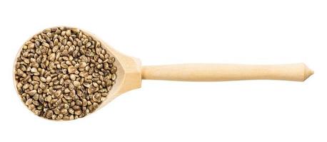 vista superior de la cuchara de madera con semillas de cáñamo sin pelar foto