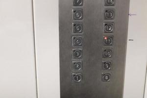 buttons in elevator in urban apartment house photo