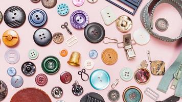 many various sewing objects on pink background photo