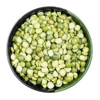raw dried green split peas in round bowl isolated photo