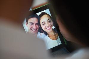 couple at modern home using tablet computer photo