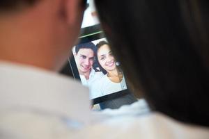 couple at modern home using tablet computer photo