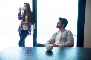 relaxet young couple drink first morning coffee photo