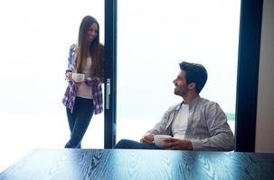 relaxet young couple drink first morning coffee photo