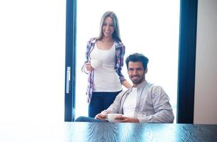 relaxet young couple drink first morning coffee photo