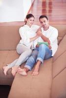couple at modern home using tablet computer photo