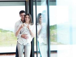 relaxet young couple drink first morning coffee photo