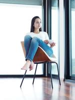 beautiful young woman drink first morning coffee photo