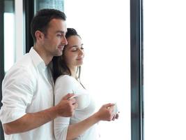 relaxet young couple drink first morning coffee photo