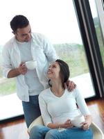 relaxet young couple drink first morning coffee photo