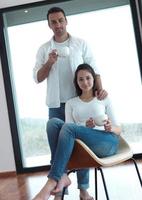 relaxet young couple drink first morning coffee photo