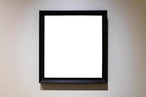 square black picture frame on gray horizontal wall photo